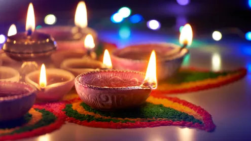 Oil lamps lit during Diwali (© phive2015/Getty Images)