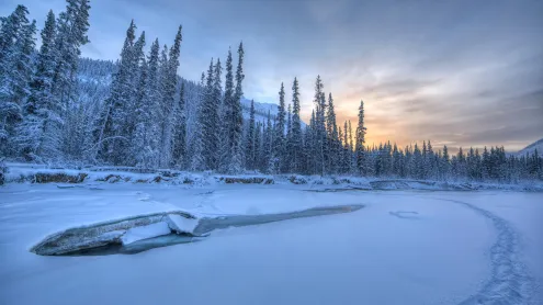 Sunset colours over the icy Wheaton River, Yukon, Canada (© Robert Postma/All Canada Photos/Alamy Stock Photo)