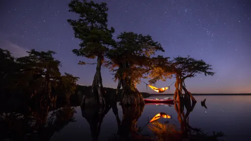 Hammock camping on a lake in Central Florida (© Mac Stone/Tandem Stills + Motion)