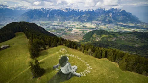 Giant land art painting 'Beyond Crisis' by Saype, Leysin, Switzerland (© VALENTIN FLAURAUD/EPA-EFE/Shutterstock)