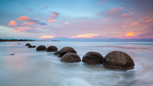 Moeraki Boulders at sunset, South Island, New Zealand (© Douglas Pearson/eStock Photo)